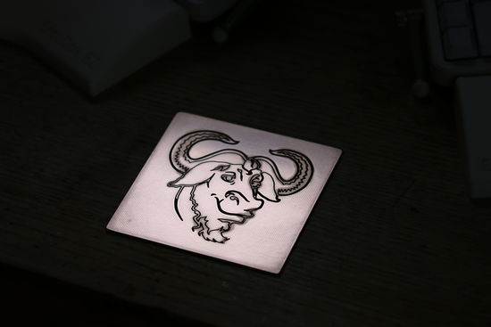 FSF RMS GNU – Logo on PCB with RGB LEDs and logo lasered in stone